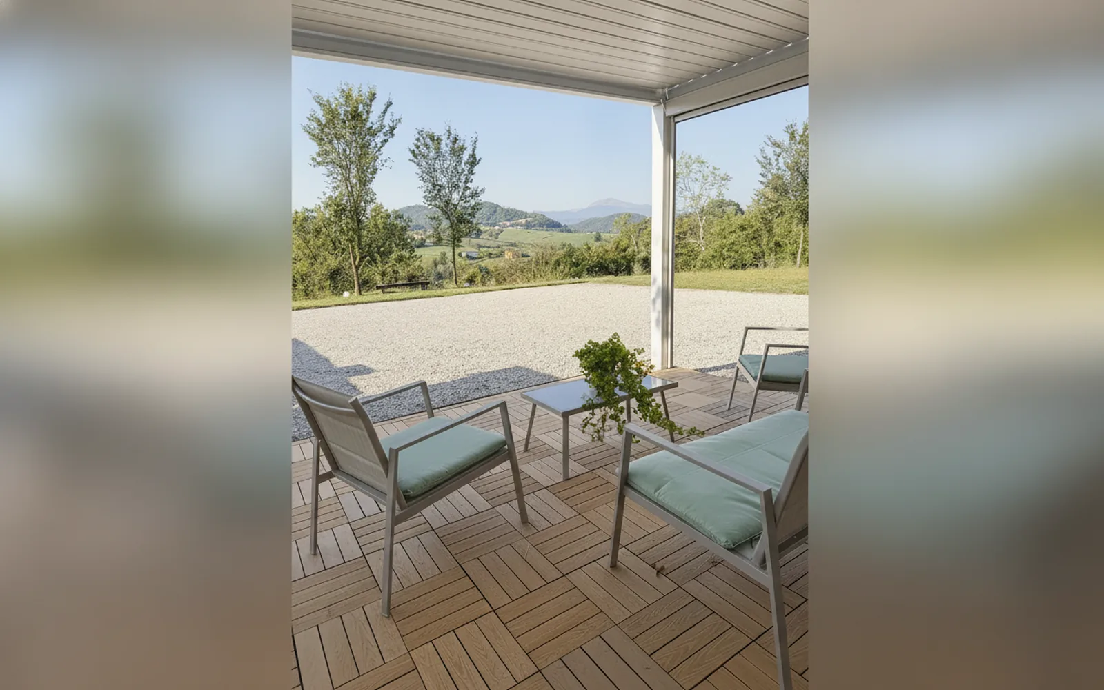 Small sofas and a coffee table on the wooden patio, looking out over the woods